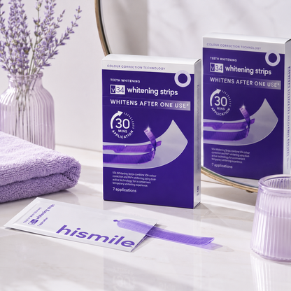 V34 Whitening Strips packaging on a bathroom counter with lavender-themed decor.